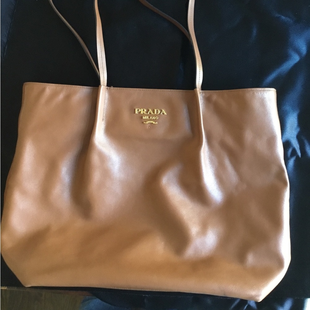 Prada leather large tote…very good condition but missing piece of logo!!!